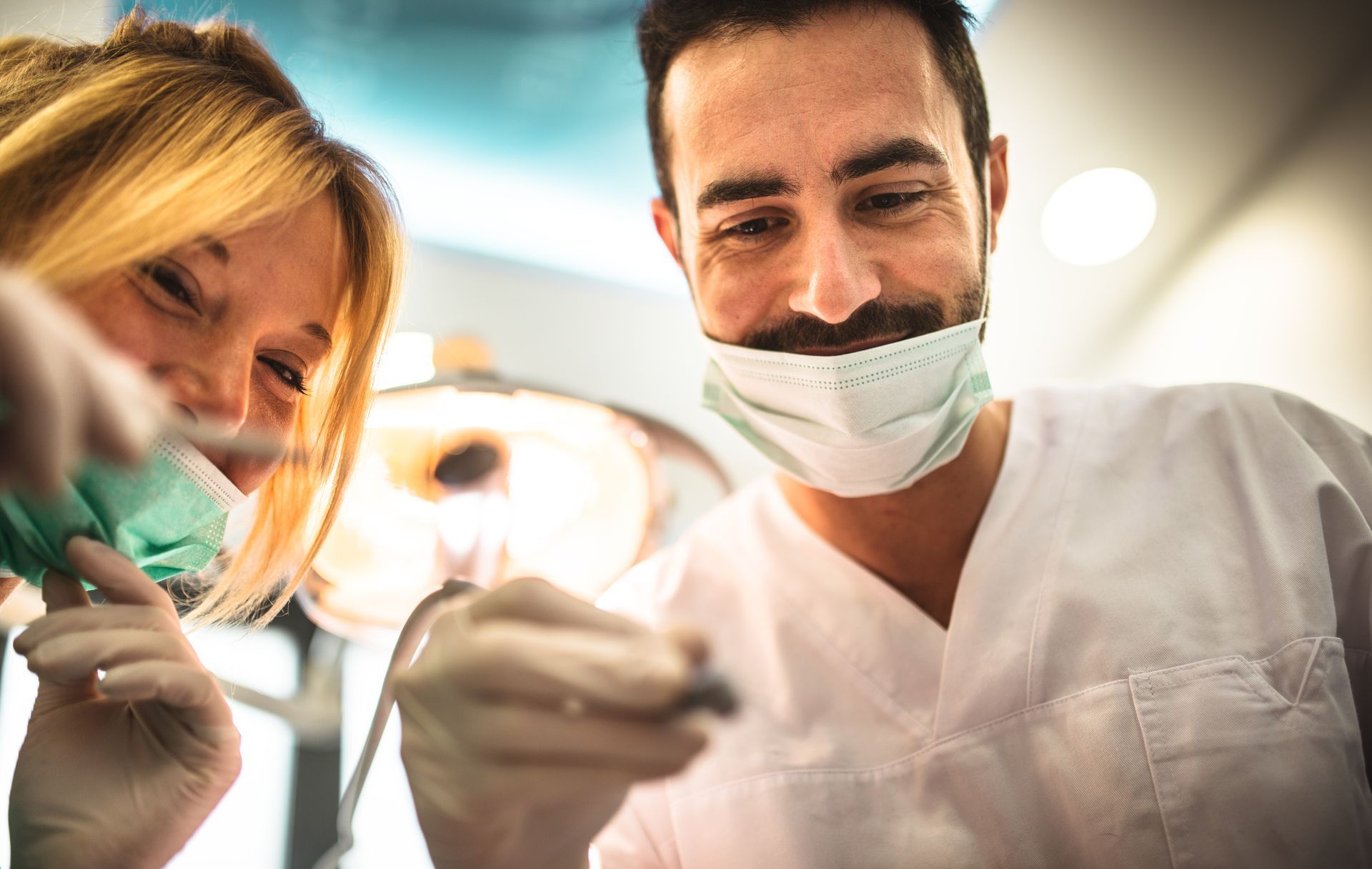 Assistant working closely with the dentist during patient treatments.