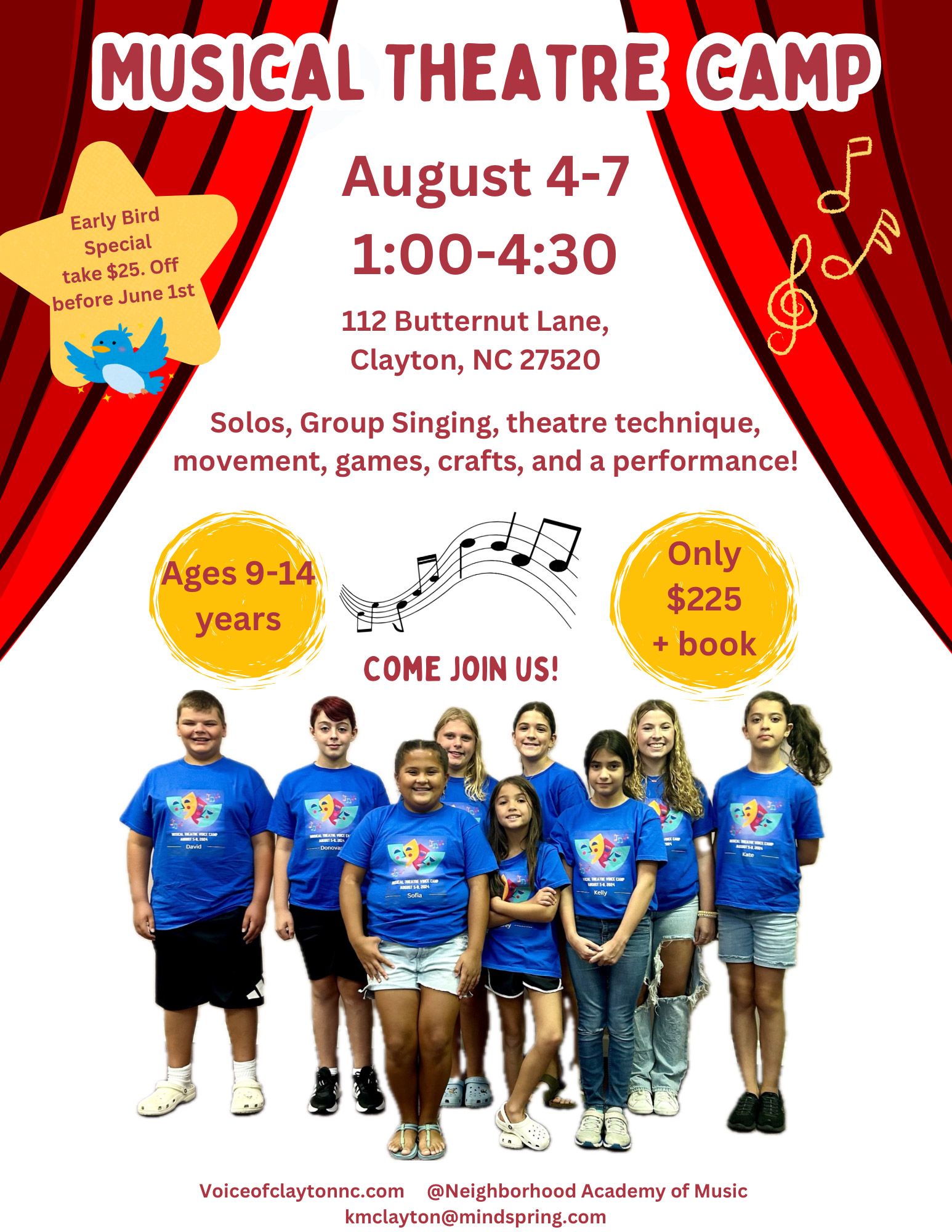 A group of children are standing in front of a red curtain.
