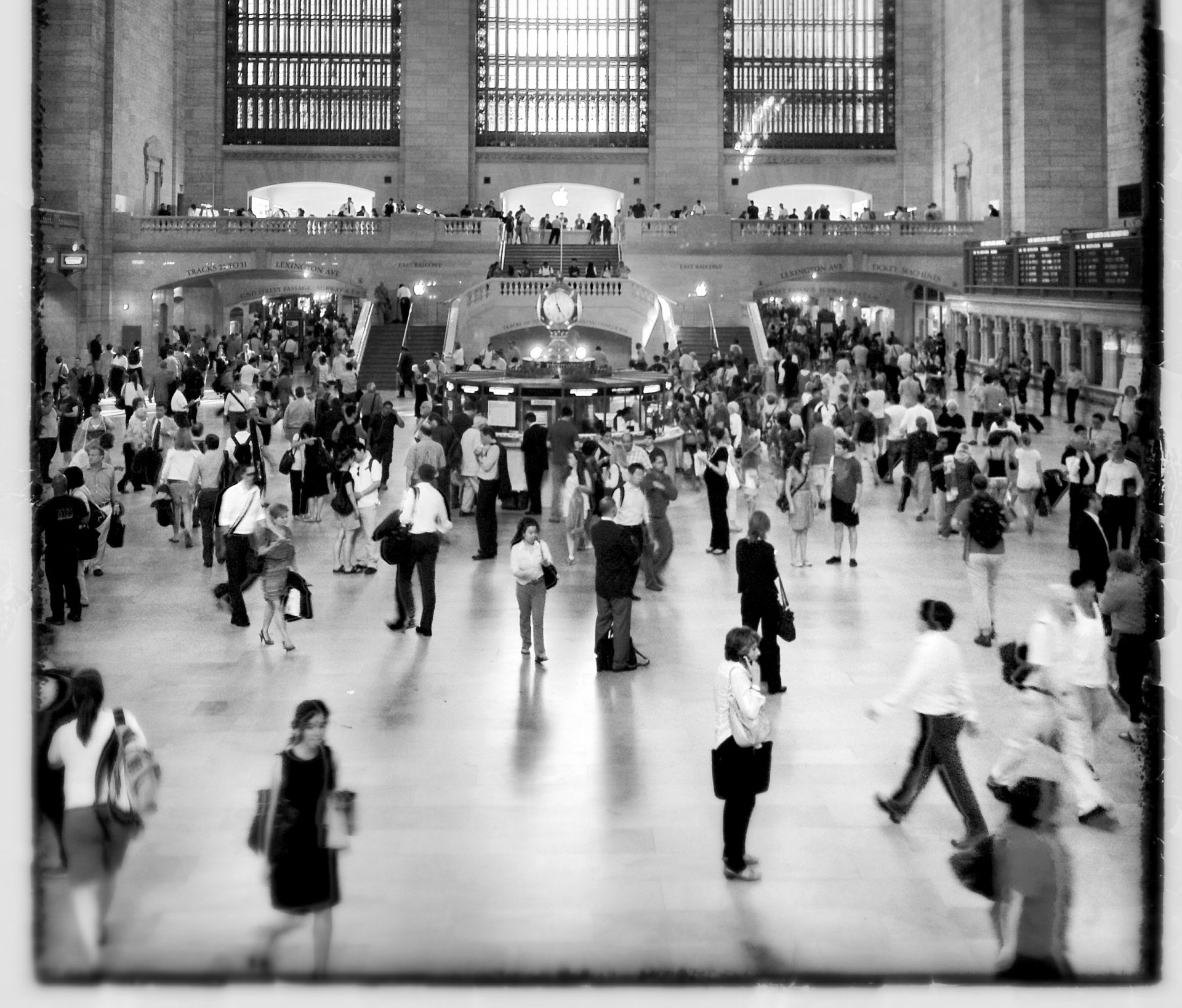 People in a train station. Photo by Chris M. Moore via Freely