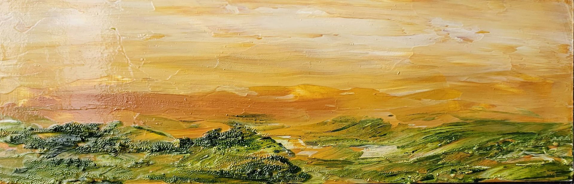 #O-84 Oil on Masonite 9 in. x 3 in. Framed. The foreground is lush with greenery; contrast, the sky and background are bathed in yellows and earth tones.