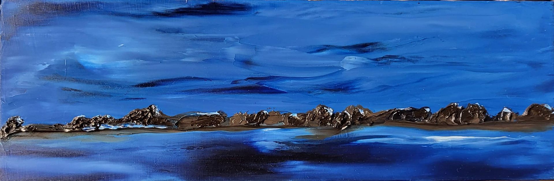 #O-71 Oil on Masonite 9 in. x 3 in. with small easel. A midnight sky reflected in the water below.  The shore line and its peeks reflect the moonlight. The blending of Prussian, Manganese blues with white create a peaceful feeling. The lone wavelet highlighted in white belies the calm.