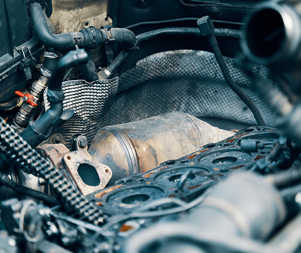 A close up of a car engine with a diesel particulate filter.