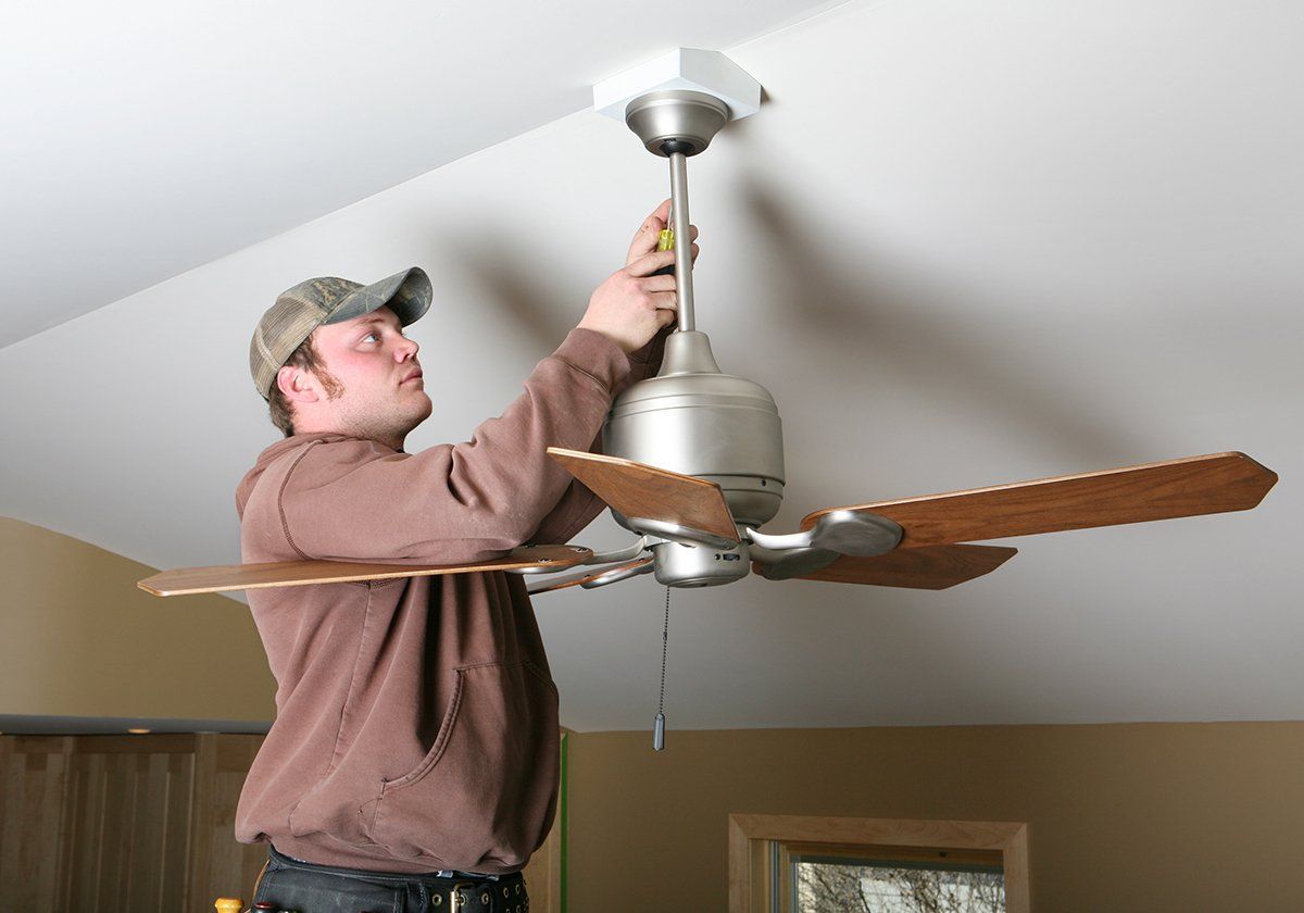 Man Checking The Ceiling Fan — Santa Ana, CA — A Dan The Handyman