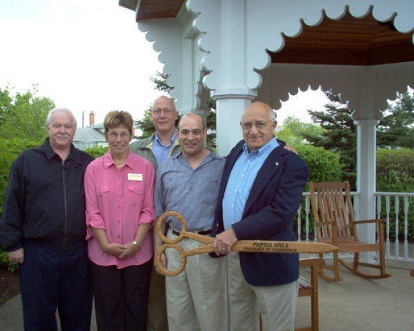 Man Holding a Big Scissor — Cleveland, OH — Park Creek Center