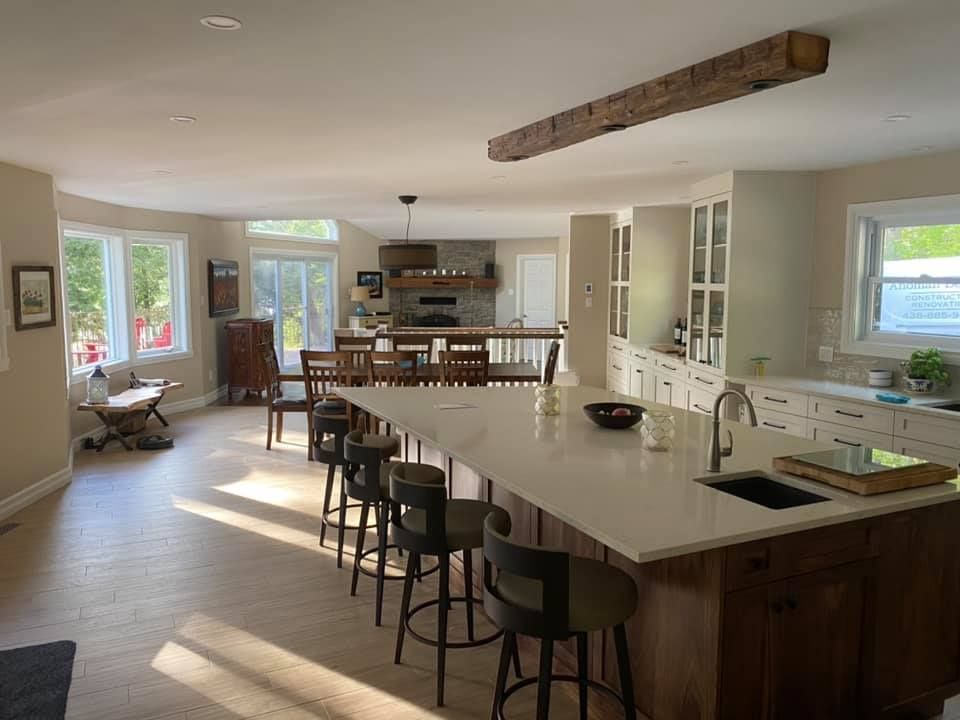 There is a large island in the middle of the kitchen.