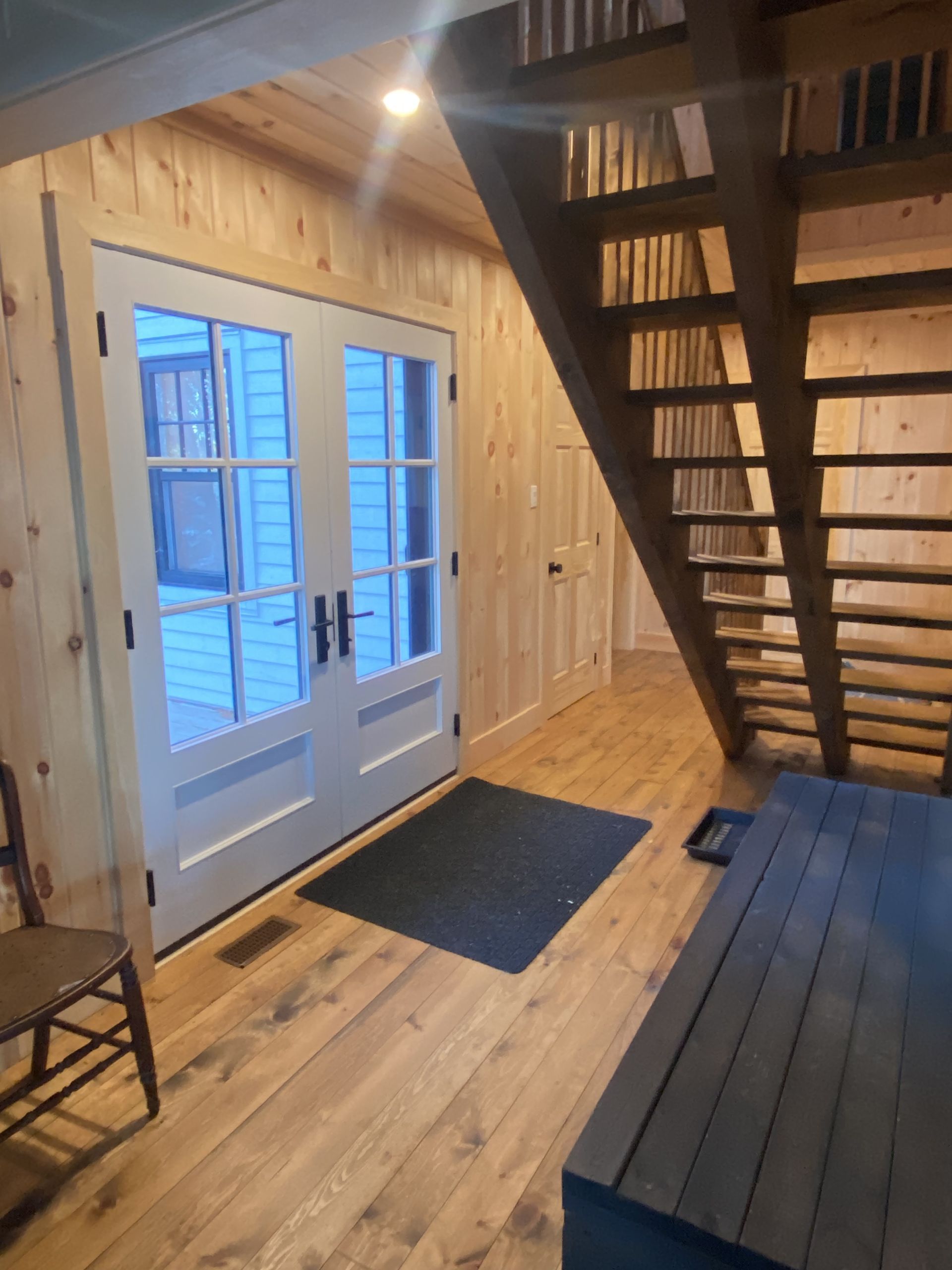 A wooden staircase leading up to the second floor of a house