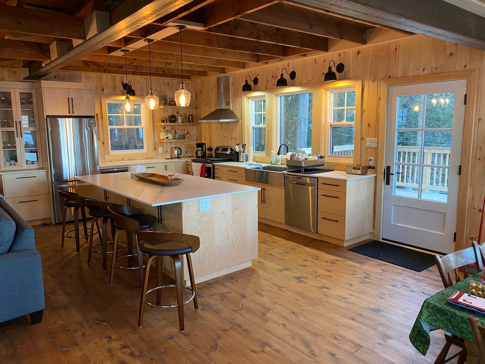 A large kitchen with stainless steel appliances and a large island.