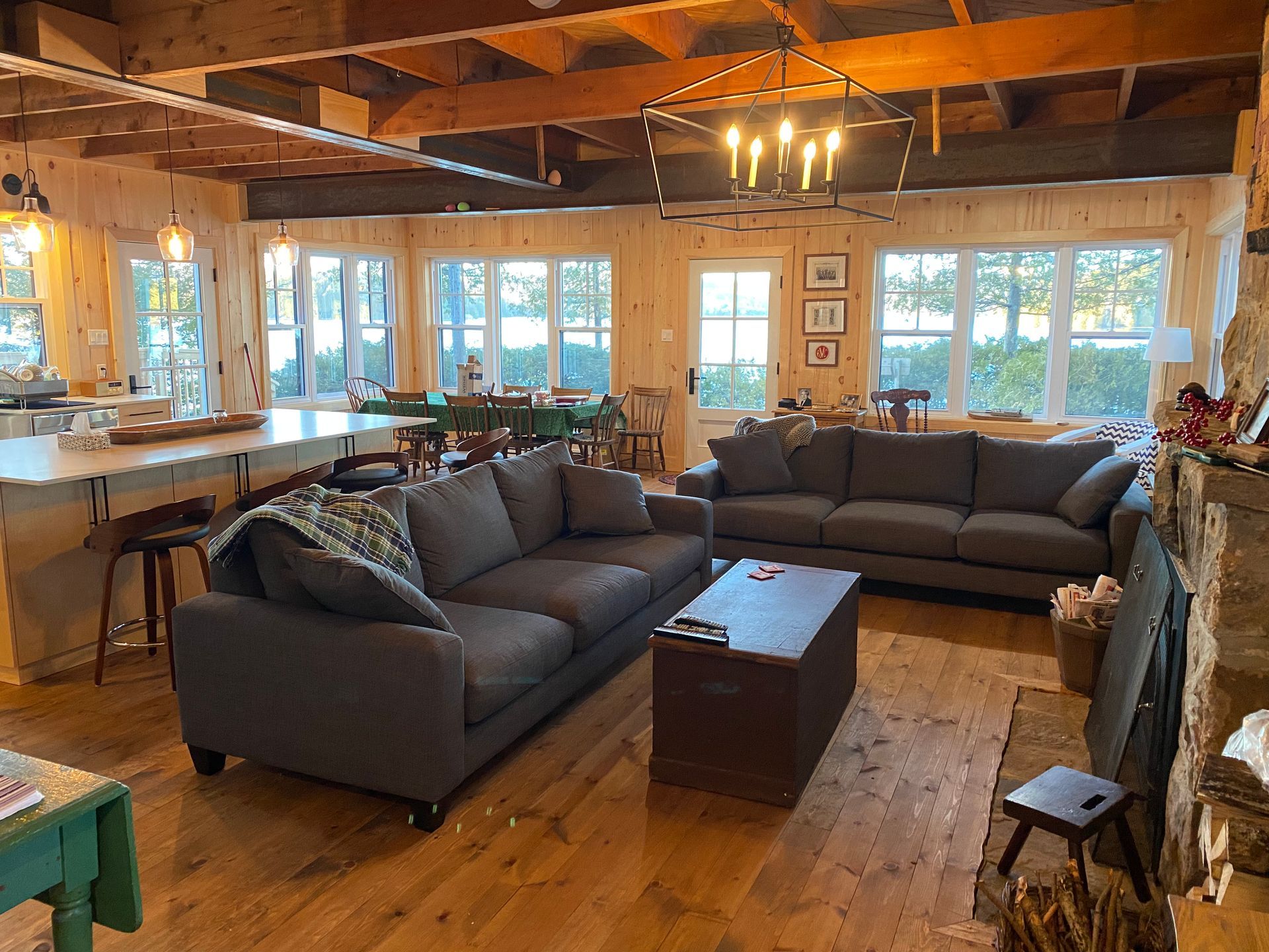 A living room with two couches , a coffee table and a fireplace.