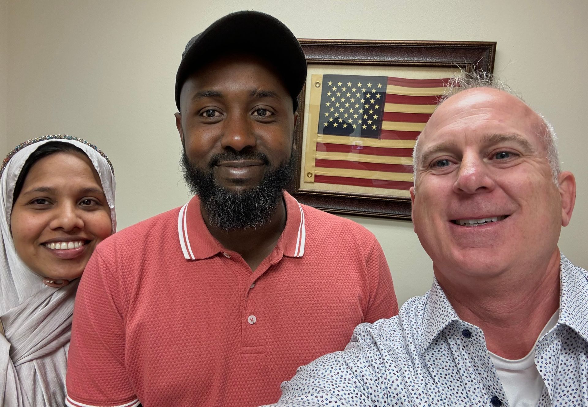 Brian posing with two happy clients!