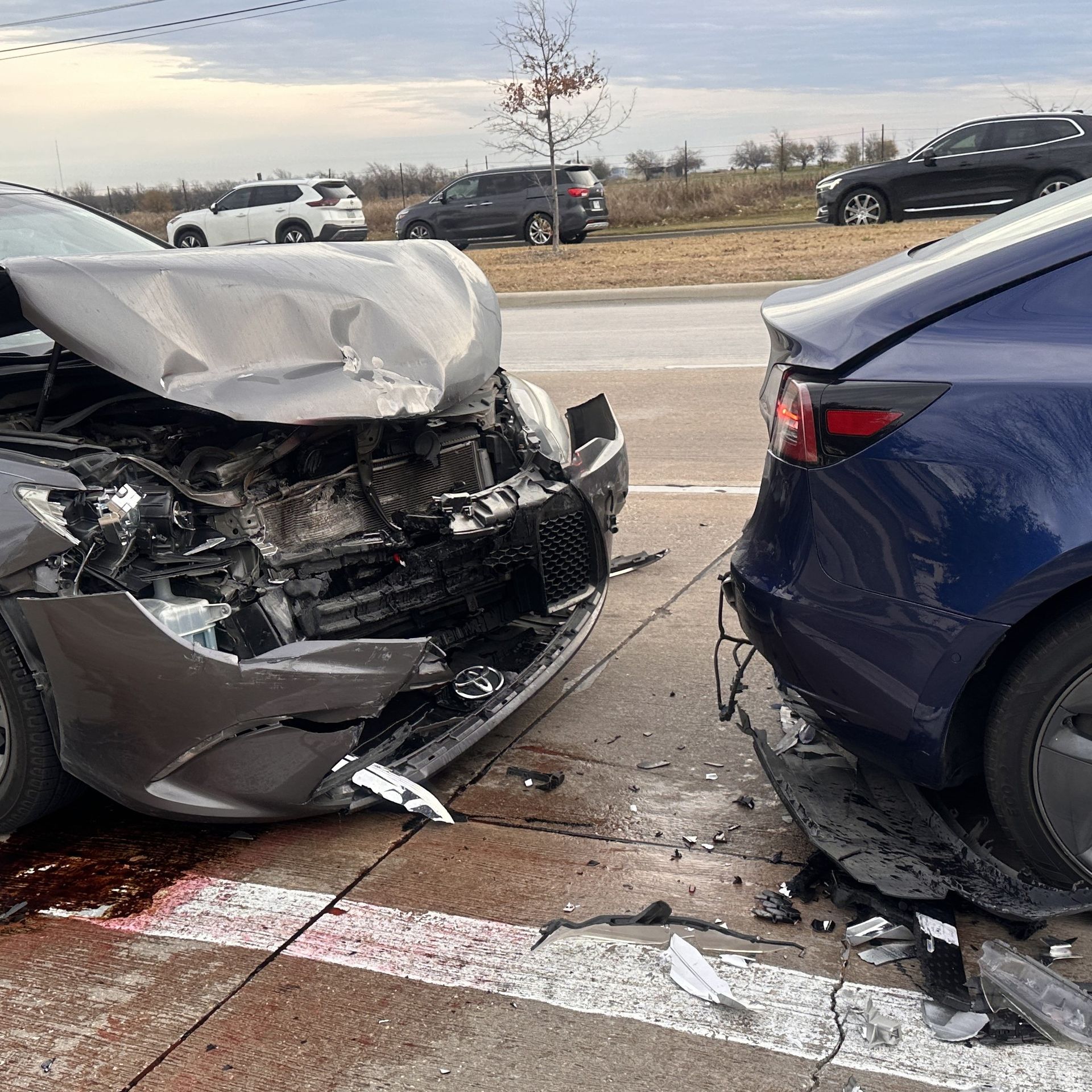 Grey sedan rear-ends a blue car on Coit Road in Frisco
