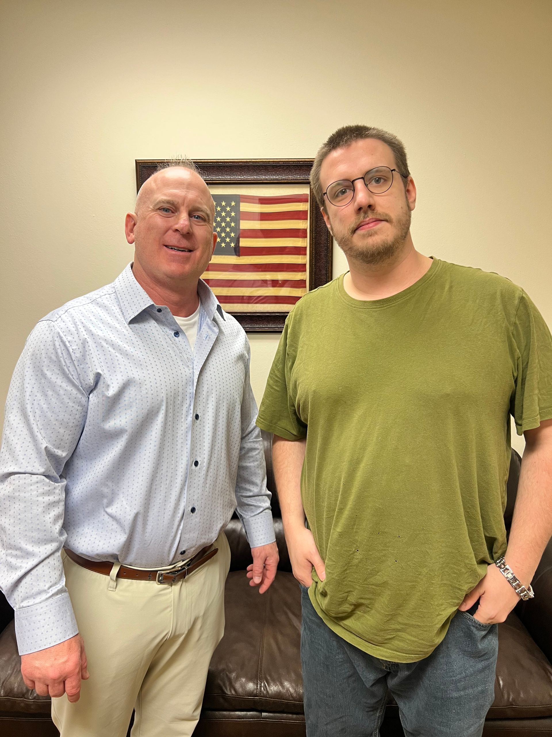 Brian with happy client, Ethan (in green) after settlement.