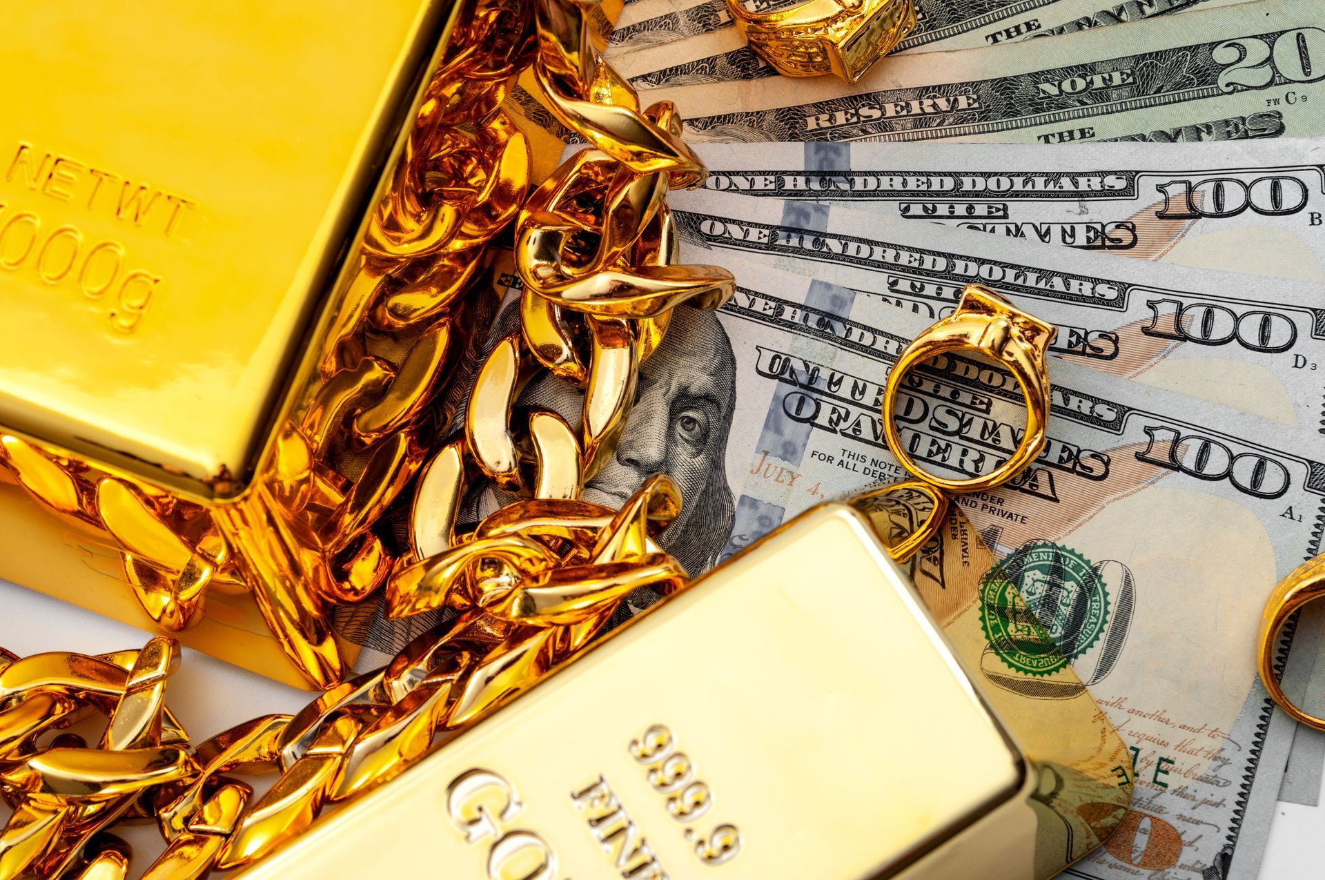 Jewelry buyer and pawn shop theme featuring gold bars, rings, and chains over dollar bills.