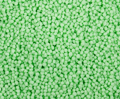 A close up of a pile of fertilizer granules
