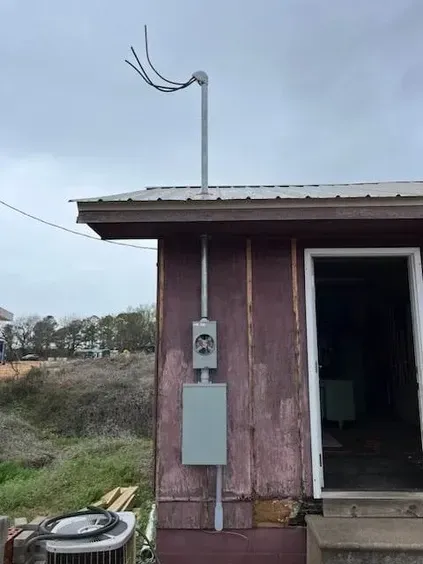 A house with a box on the side of it.