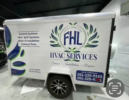 A white trailer that says fhl hvac services on it