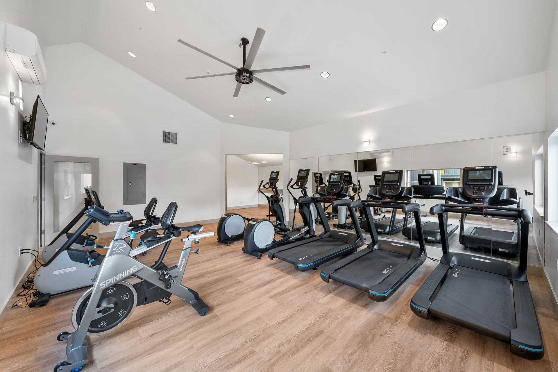Fitness center with treadmills, stationary bikes, and ellipticals.