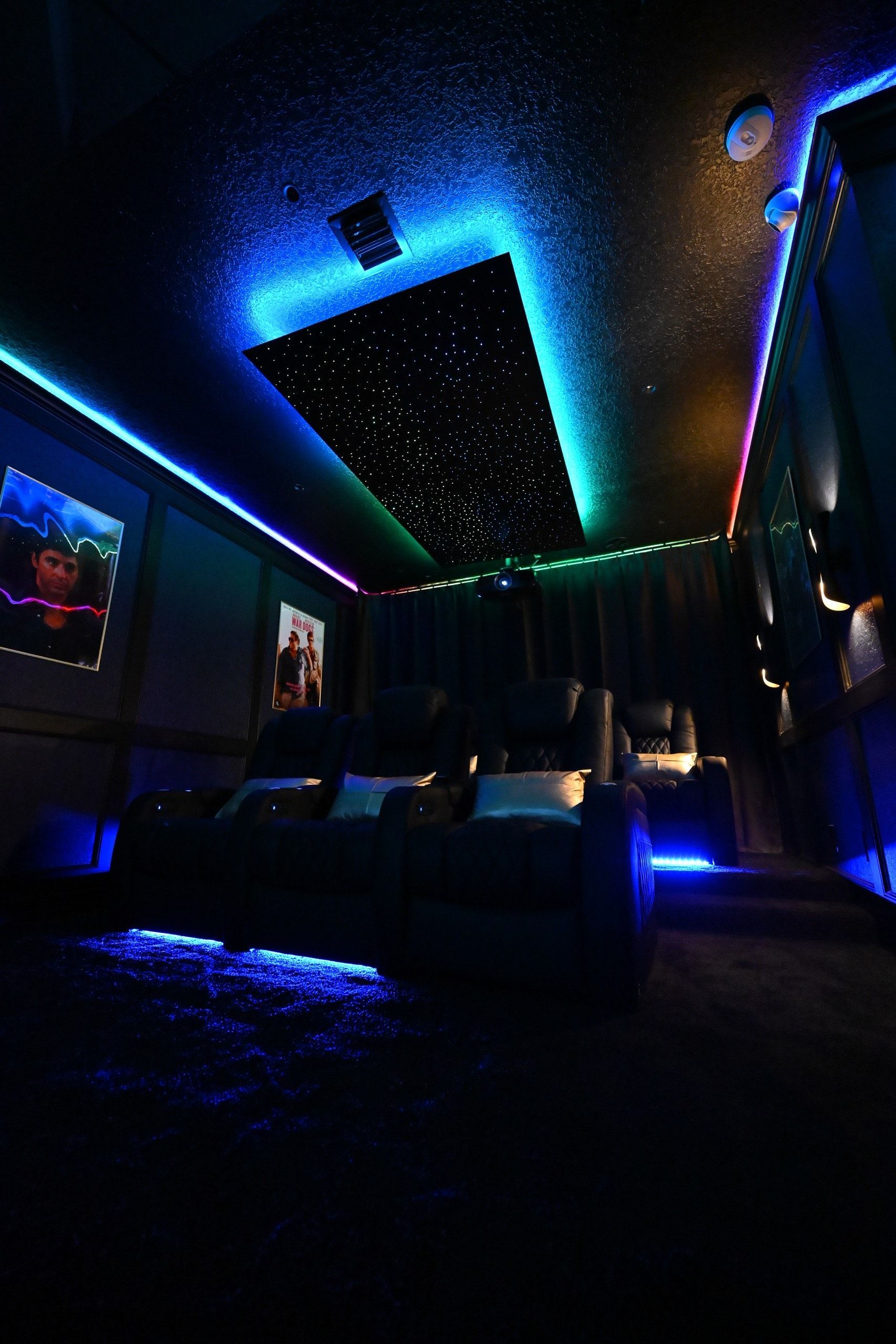 A dark room with a lot of lights on the ceiling