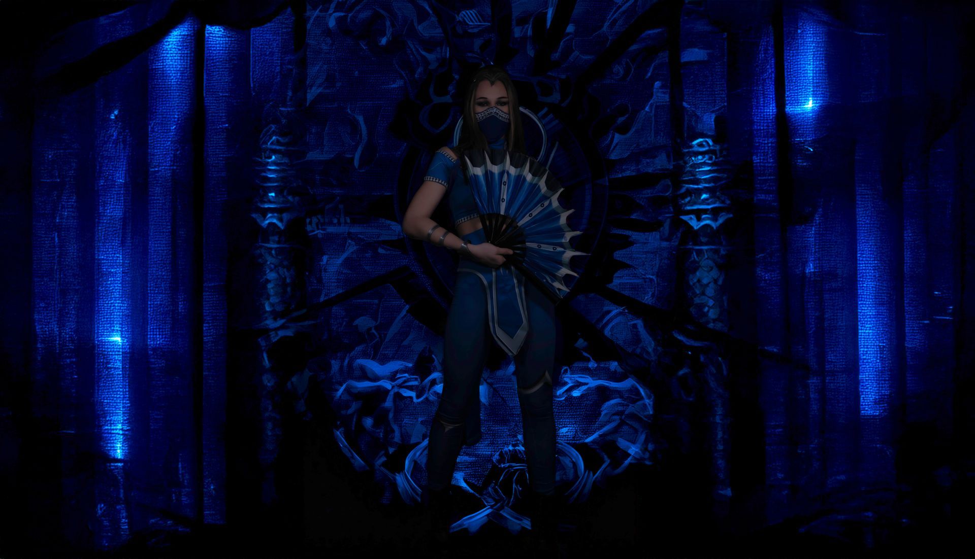 A woman is standing in a dark room holding a fan.