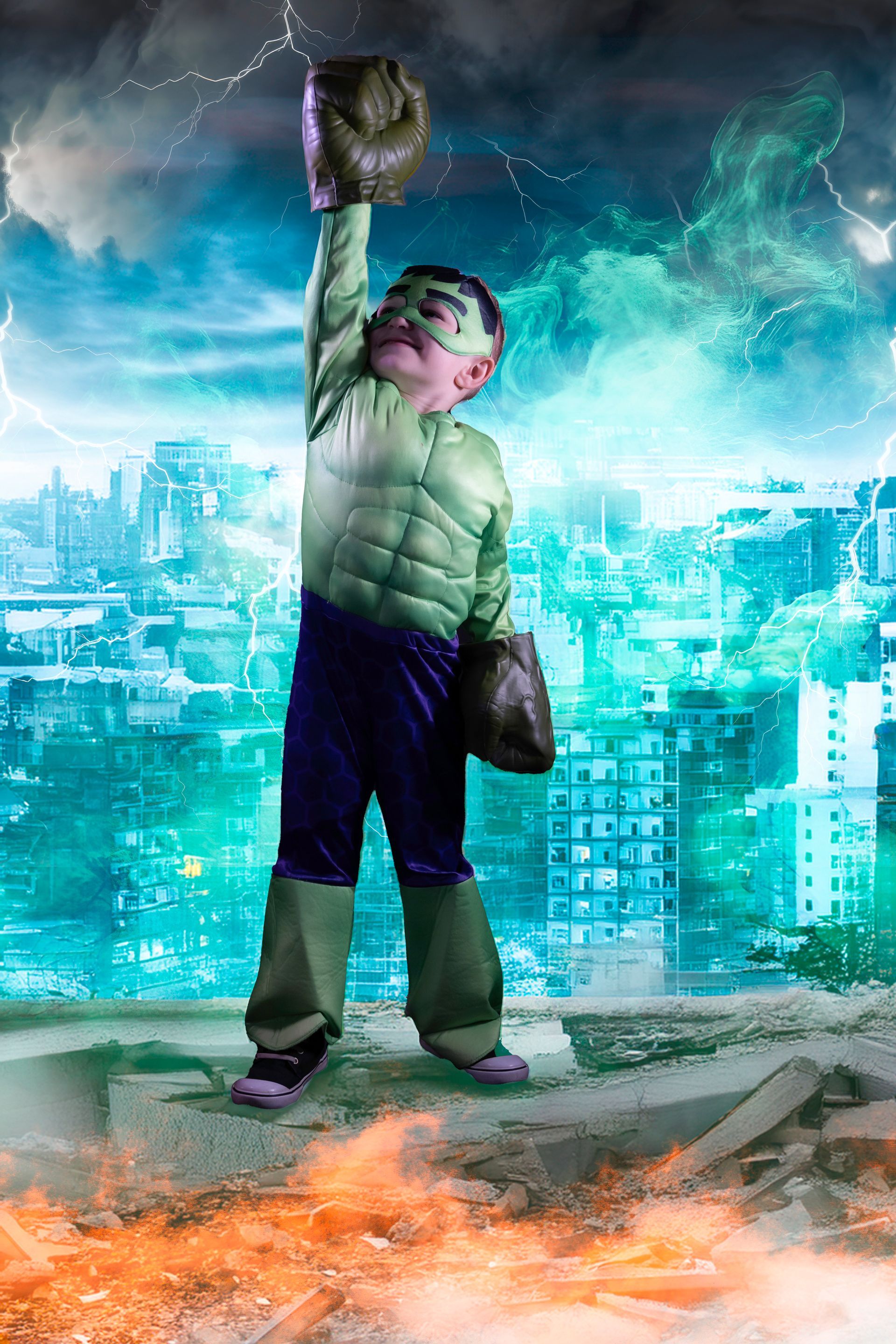Boy in Hulk costume with raised fist stands on rooftop, cityscape, and lightning in background.