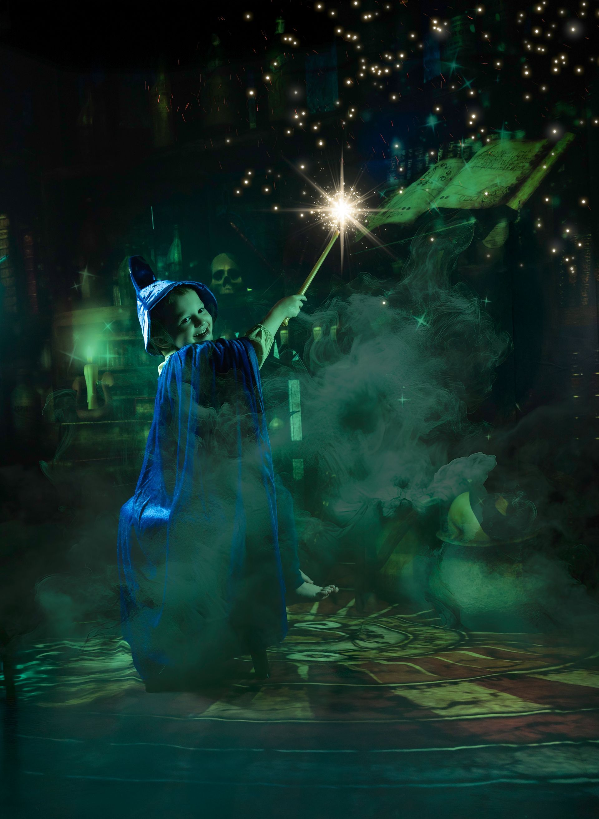 Person in blue wizard costume casts magic with wand, surrounded by green fog and sparkling lights.