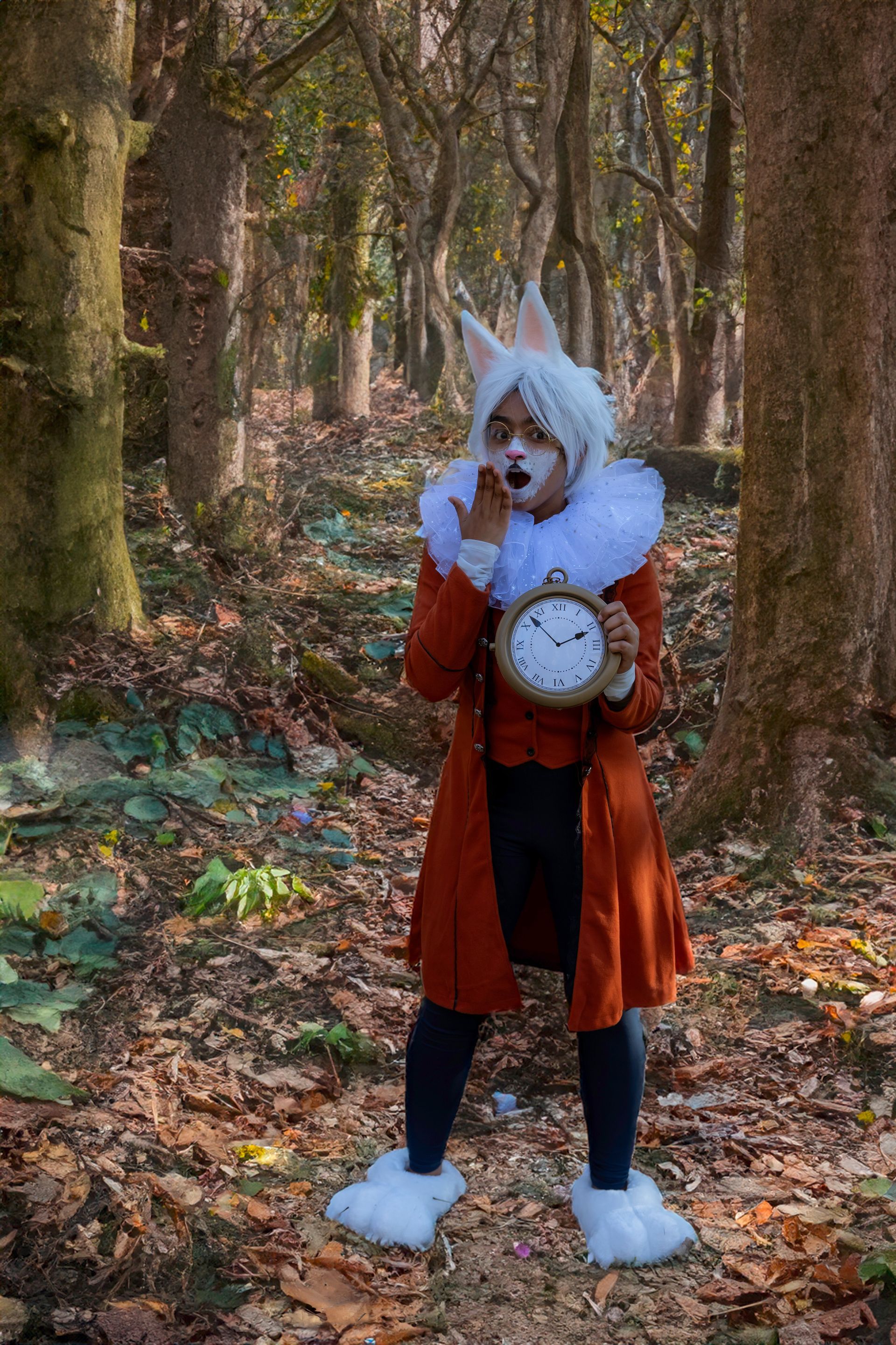 A person in a costume is holding a clock in the woods.