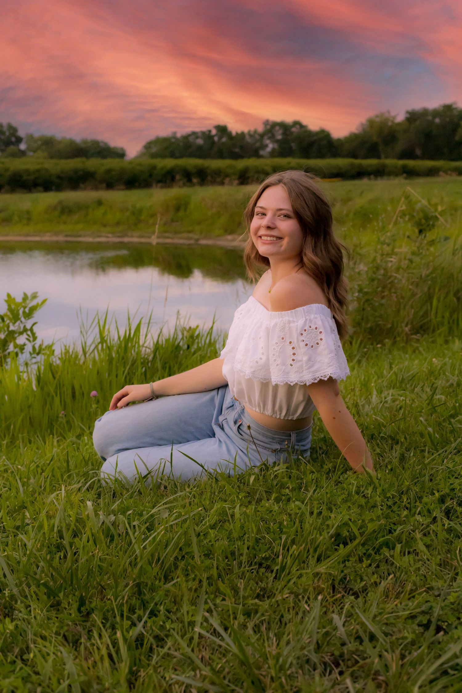 A young woman beside the lake posing for a candid shot