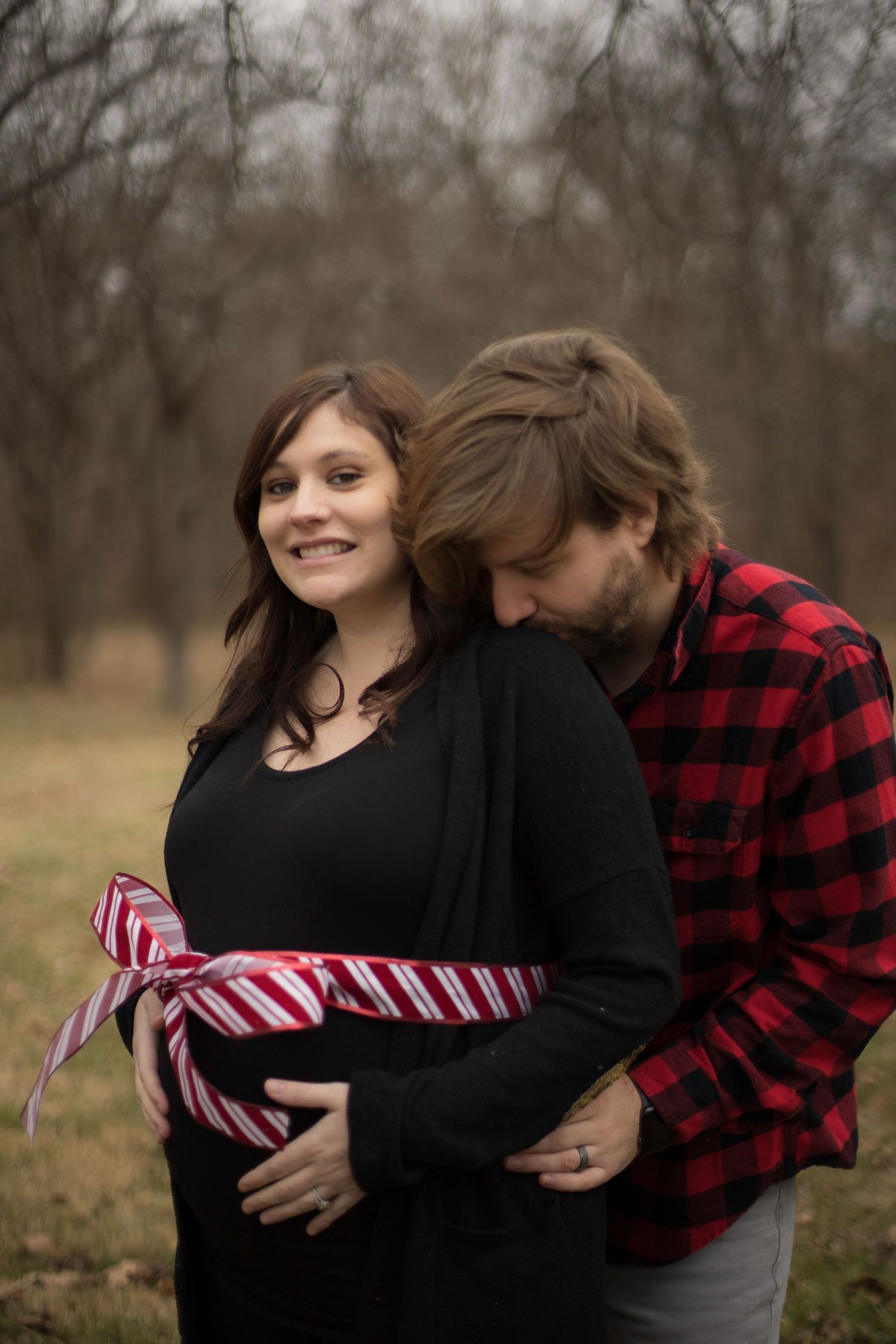 Pregnant Woman with a Ribbon on Her Baby Bump