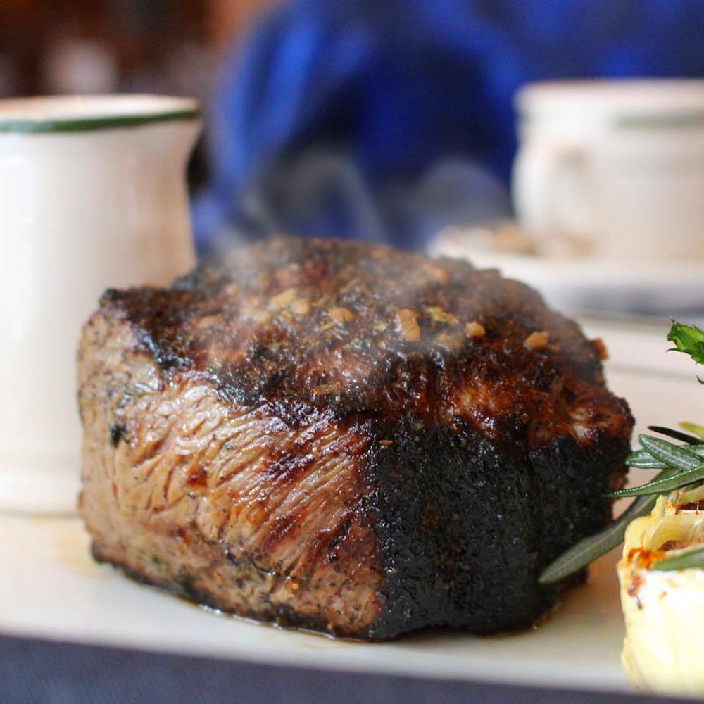 A close up of a piece of meat on a plate