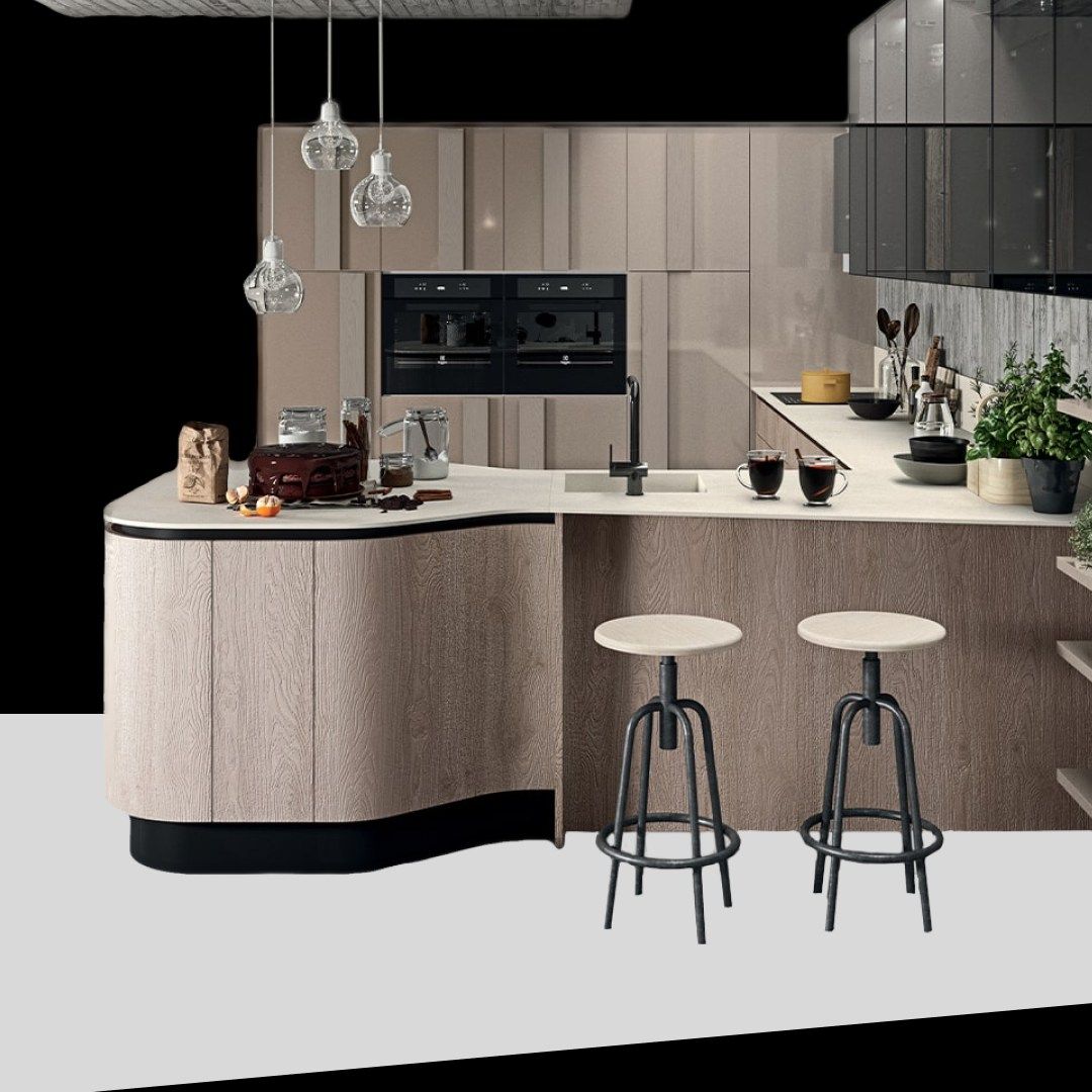 Una cucina con una grande isola e due sgabelli