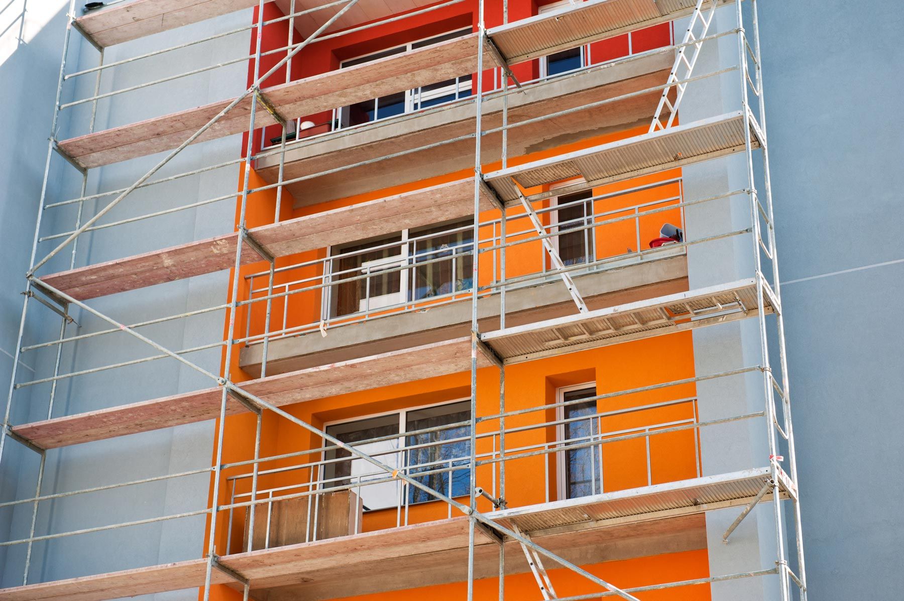 Scaffolding on Orange Painted Building — San Francisco, CA — Pacific Scaffold Co.