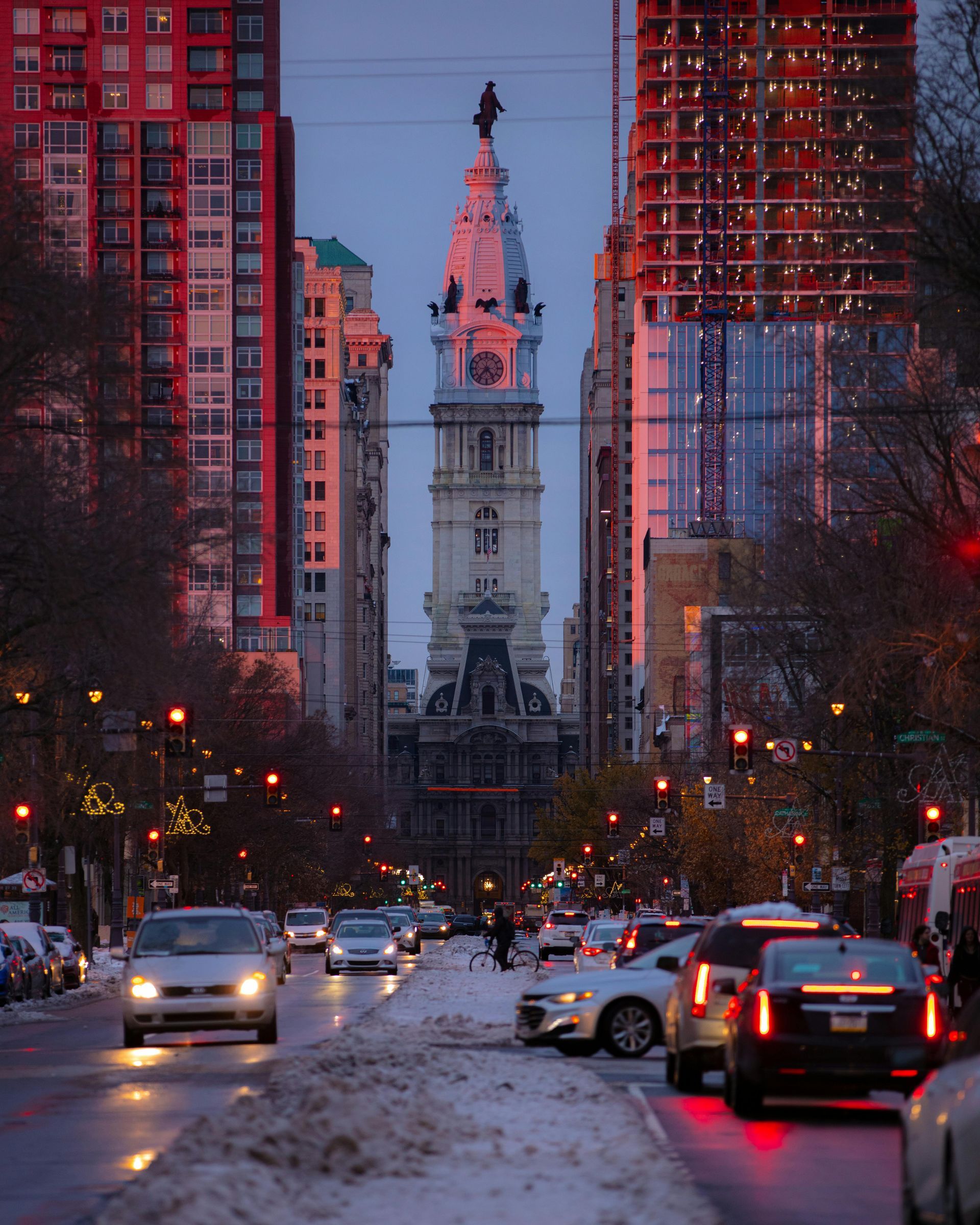 A city street with a clock tower in the background