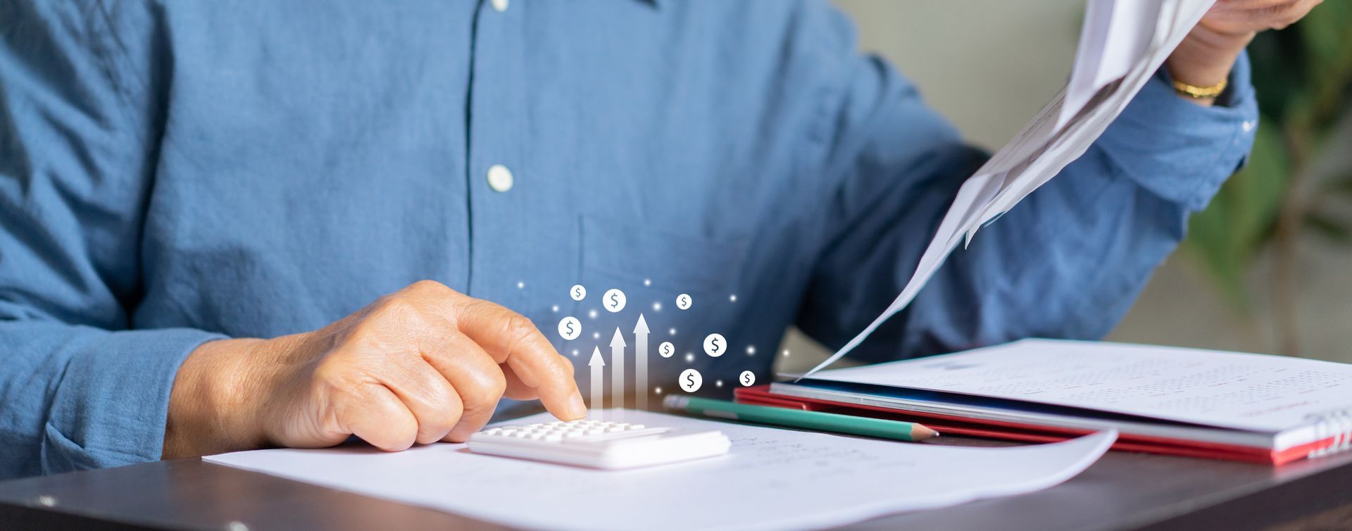 Woman in straw hat smiles, holding wine glass near a lake.