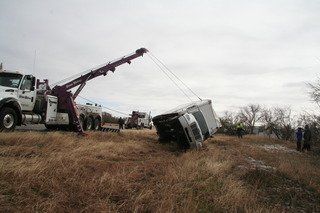 Tractor-trailer towing to get truck out of a ditch in San Angelo, TX