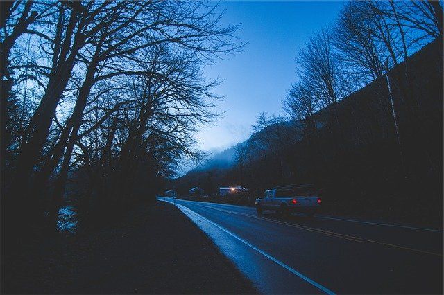 Home Motors, Inc fleet truck providing roadside assistance at night