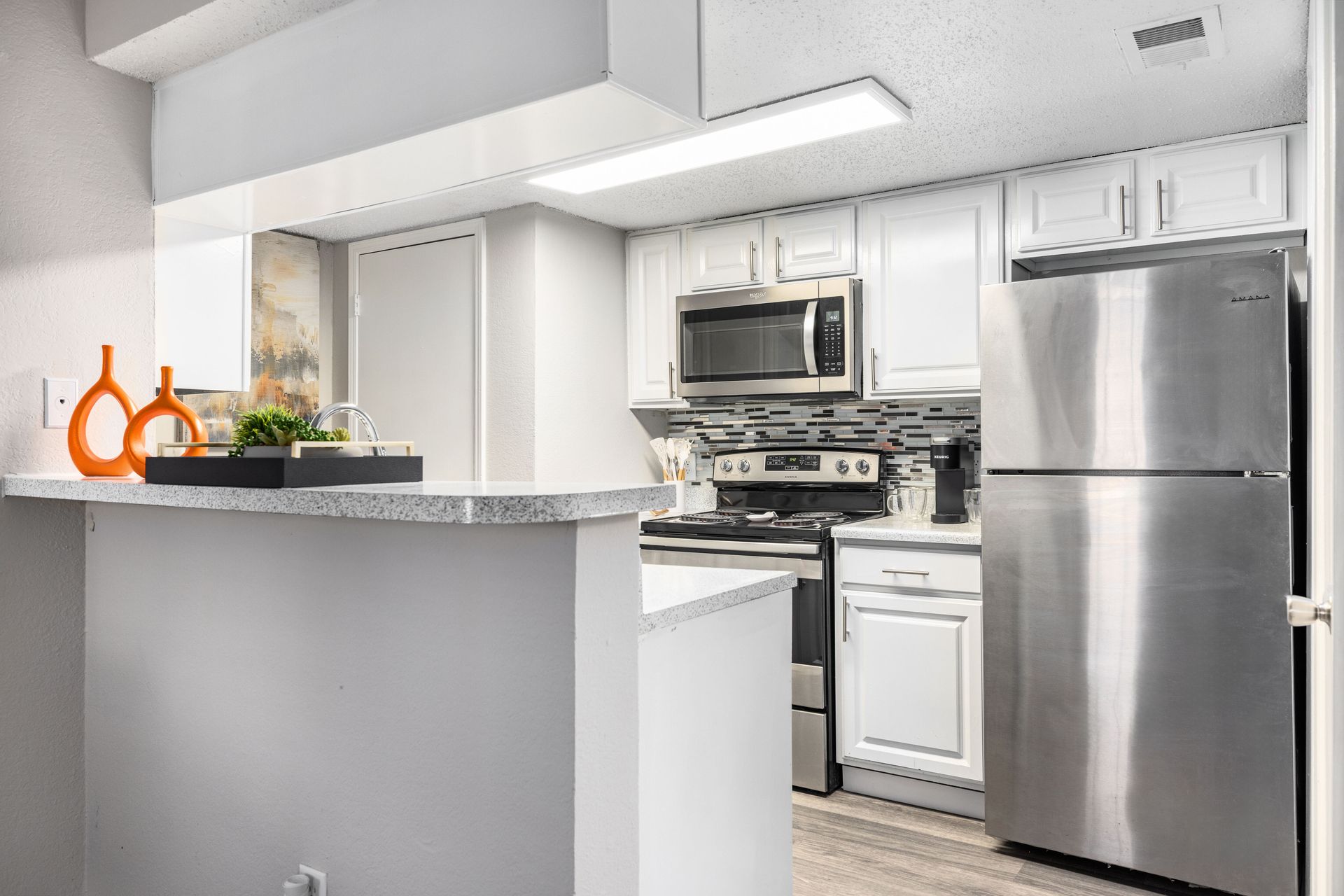 A close up of a stove and dishwasher in a kitchen.