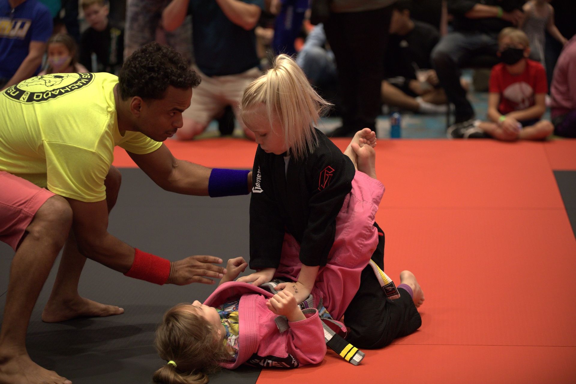two young boys are practicing judo on a mat