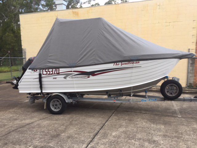 small boat with wheel side view