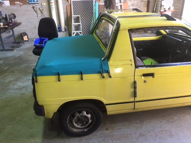 yellow truck with cover left side