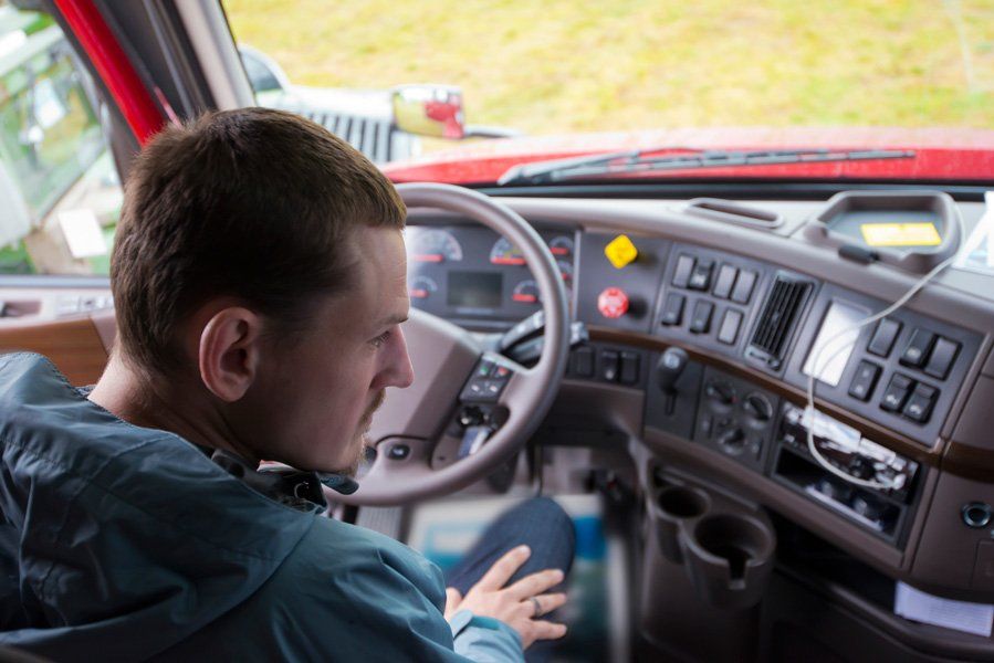 Driver Sitting Inside The Truck — Los Angeles County, CA — Commercial Trucking School