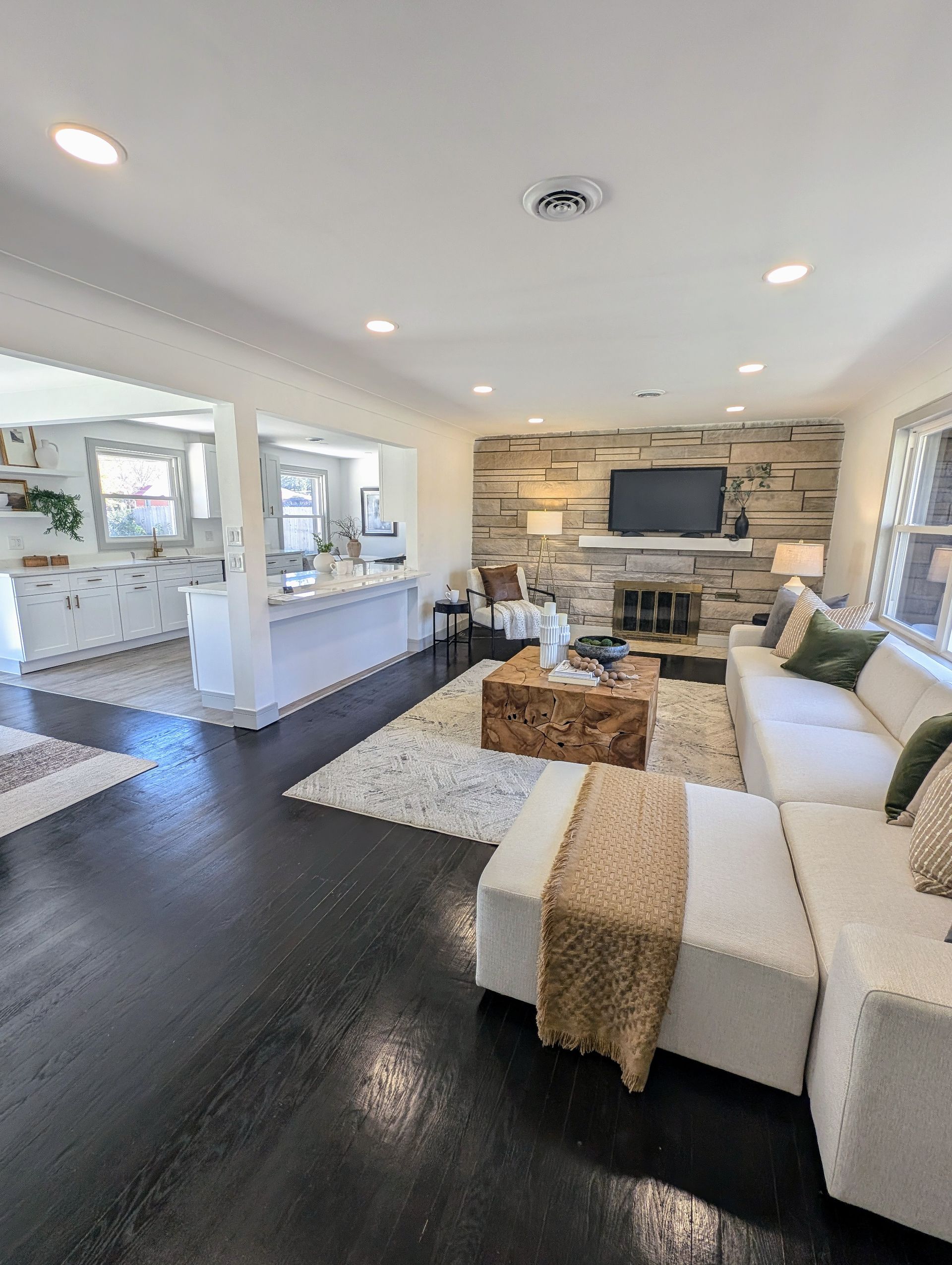 A living room filled with furniture and a fireplace.