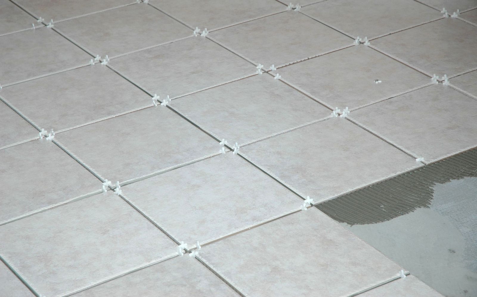 Two men are loading boxes into a van.