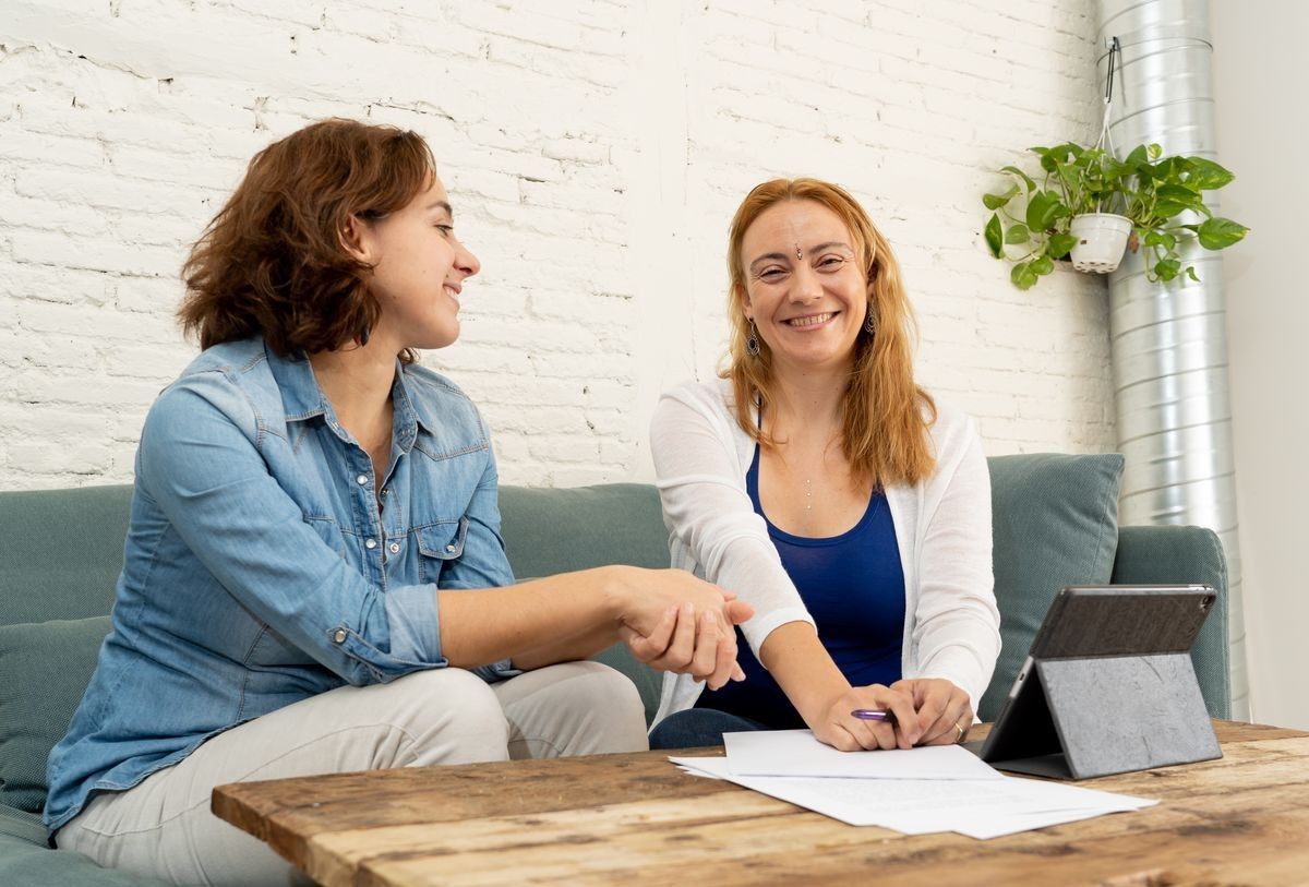 two woman talking with each other