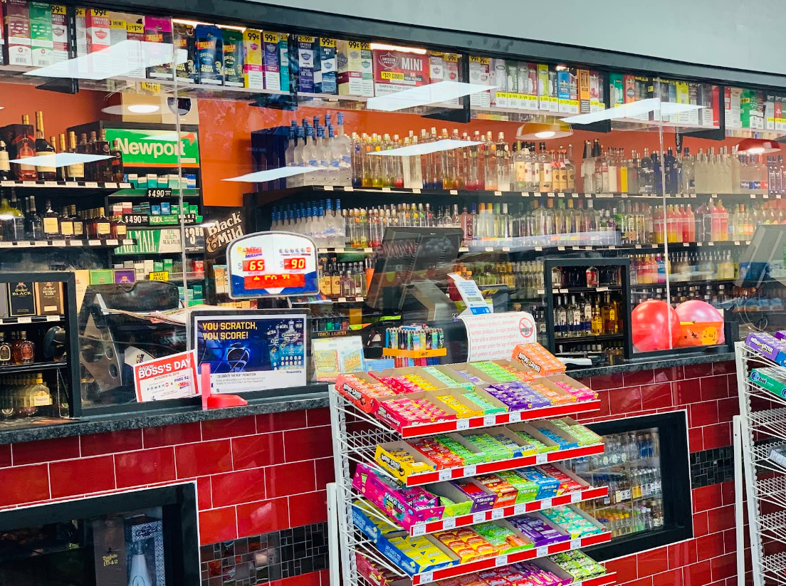 A convenience store filled with lots of candy and liquor.