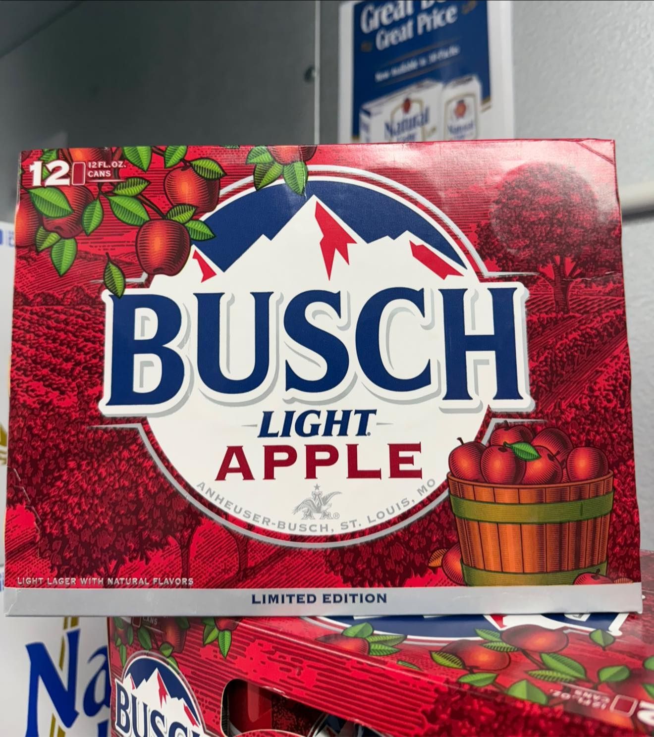 A box of busch light apple beer is sitting on a table