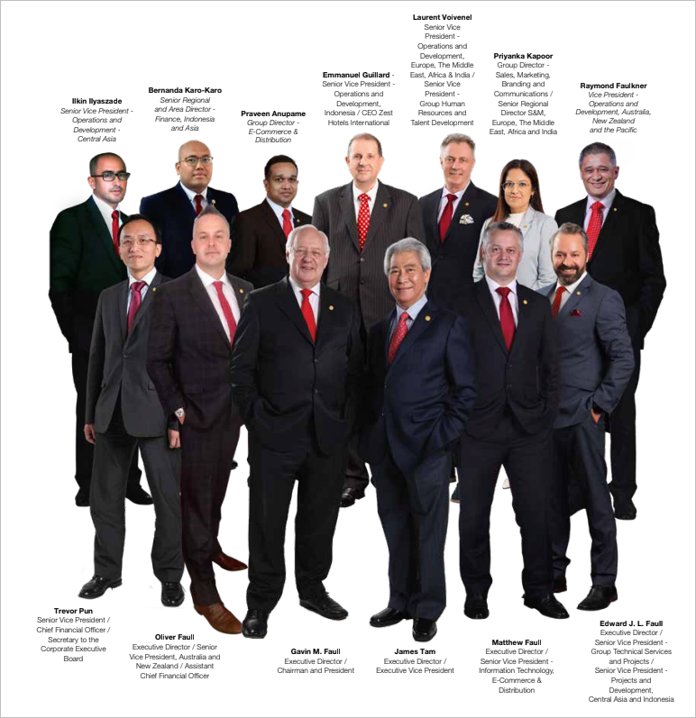 A group of men in suits and ties are posing for a picture.