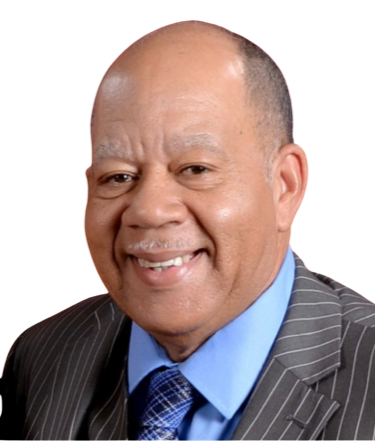 A man in a suit and tie is smiling for the camera