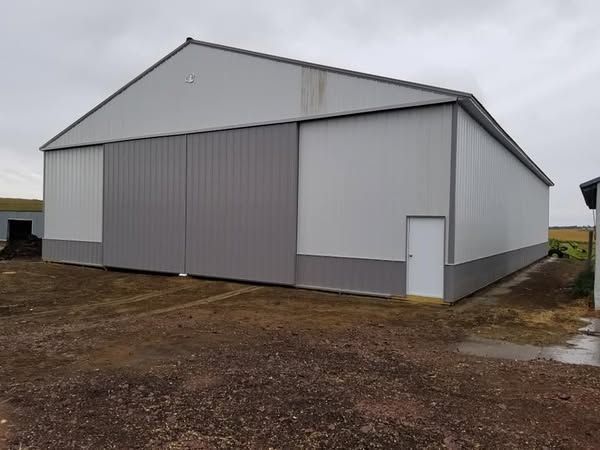 A large white building with a large sliding door