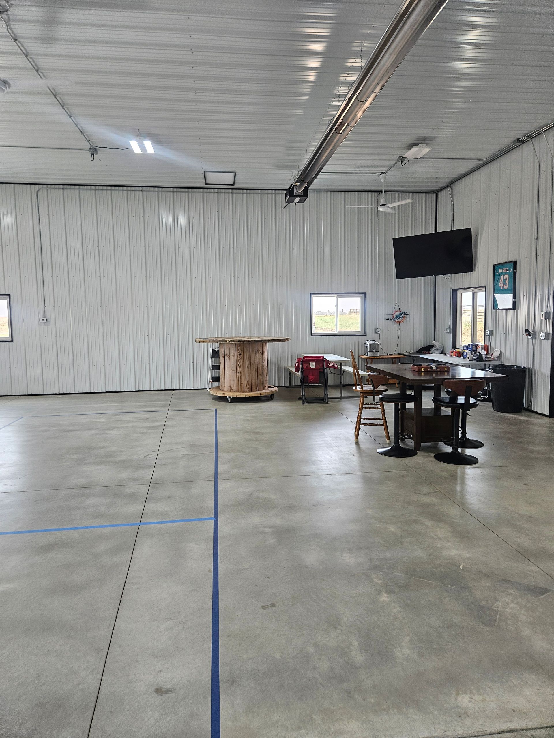 A large room with tables and chairs in it