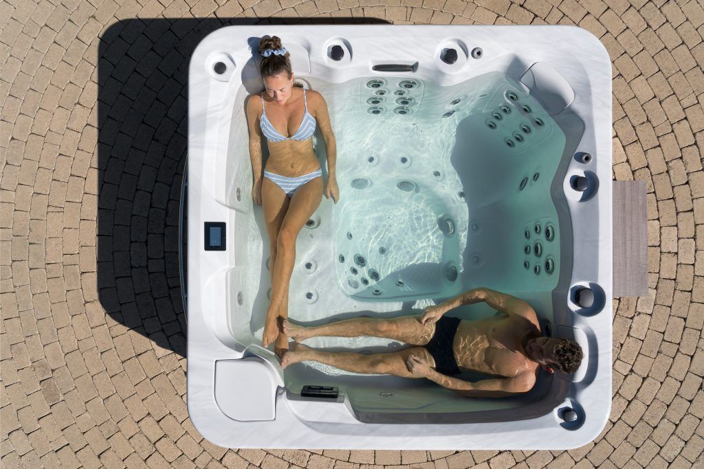 a couple enjoying a hypa spa hot tub