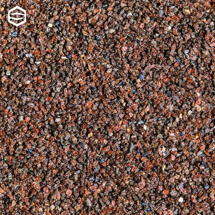 Primo piano di materiale granulare marrone dall'aspetto maculato.